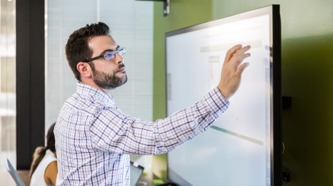 Man interacting with a smart board