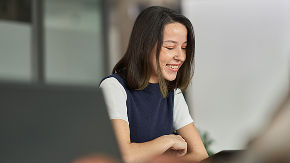Person looking down and smiling.