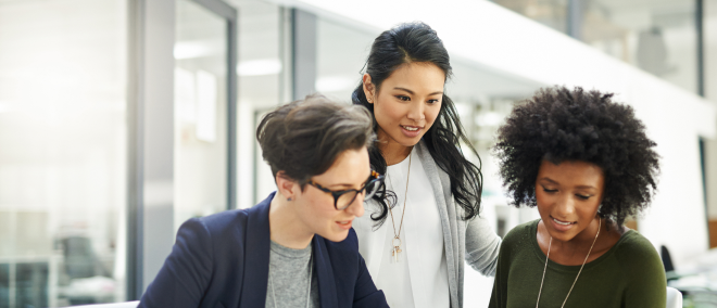 Three people collaborate.