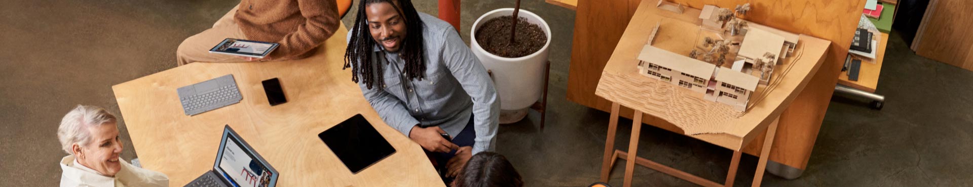 Four colleagues participate in a meeting.