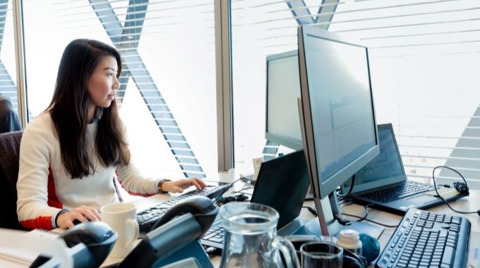 Woman working on computers