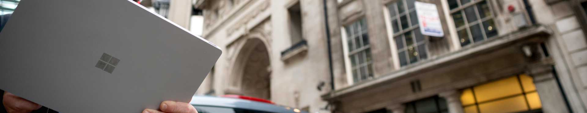 Someone using a Surface tablet in town