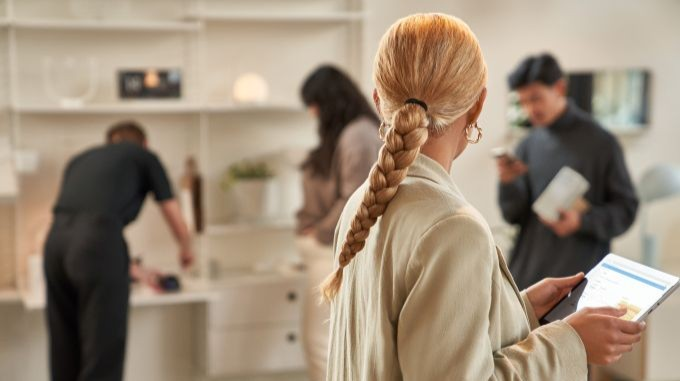 Woman standing in store with Microsoft Surface tablet