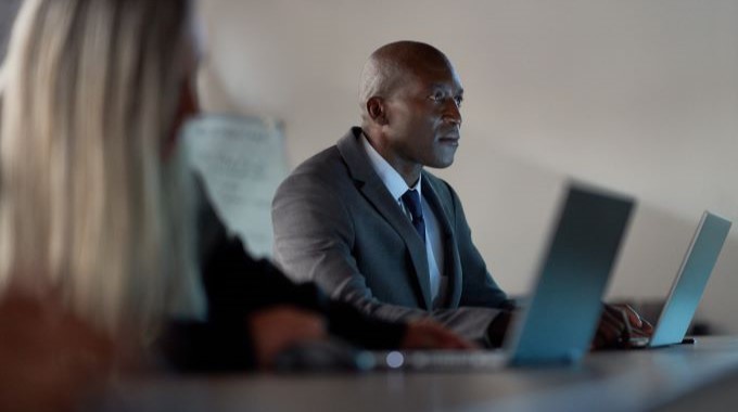 Man and woman working together in conference room